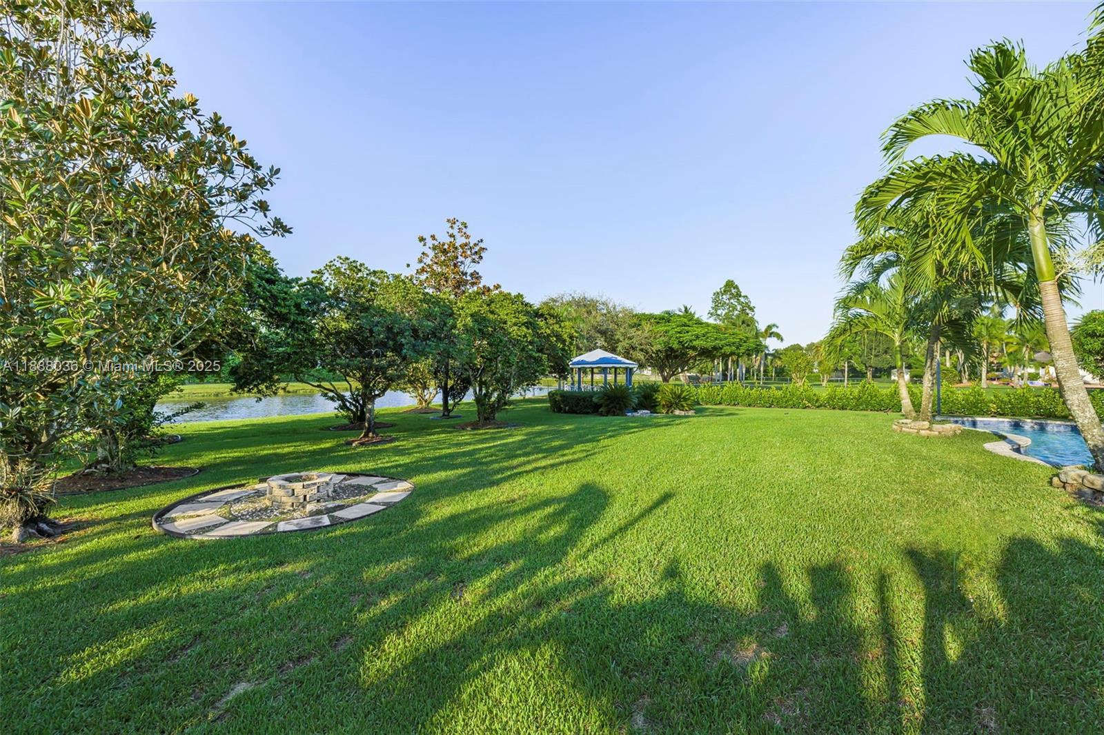 12555 Southwest 34th Place Davie, FL 33330 - Photo 27 of 73 a view of a park with trees and a sign