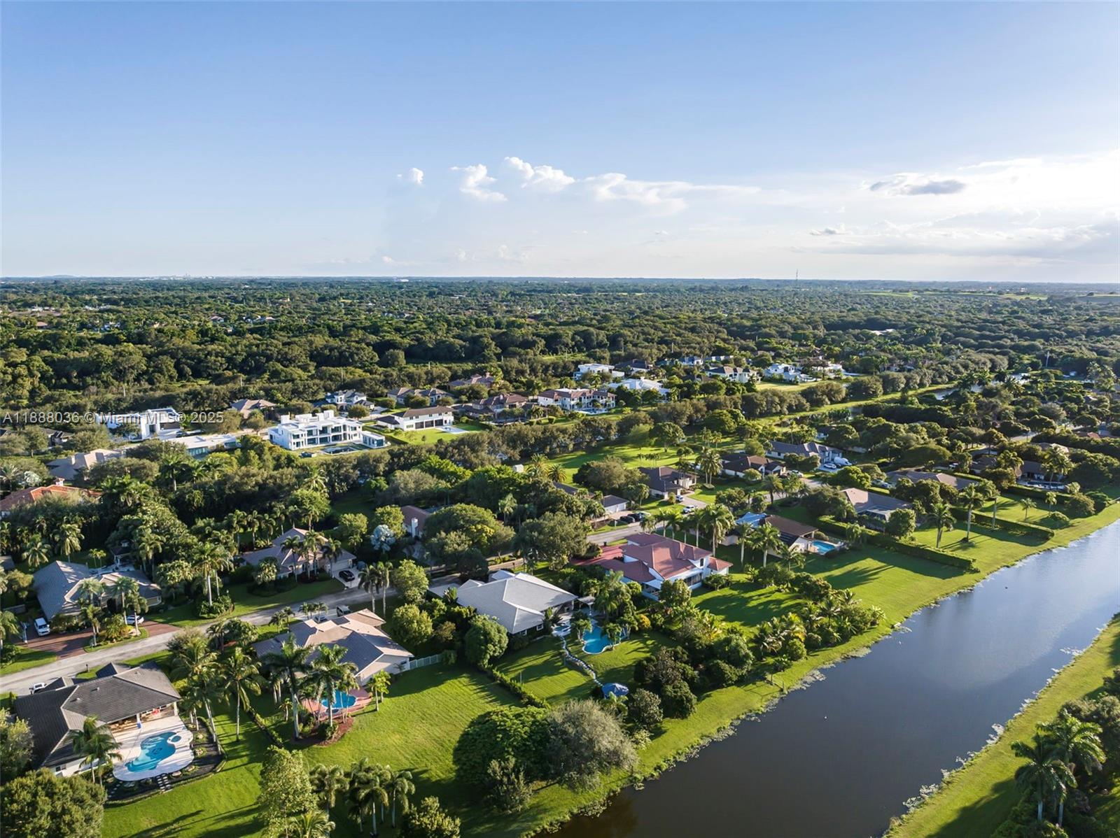 12555 Southwest 34th Place Davie, FL 33330 - Photo 29 of 73 an aerial view of residential houses with outdoor space and trees