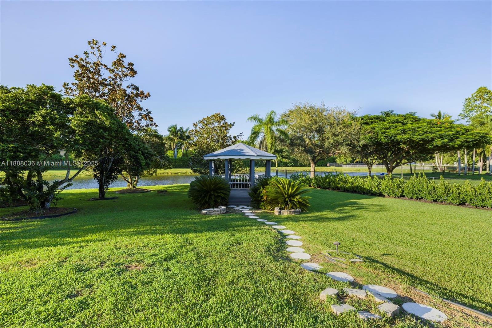 12555 Southwest 34th Place Davie, FL 33330 - Photo 33 of 73 a view of a garden with an outdoor space