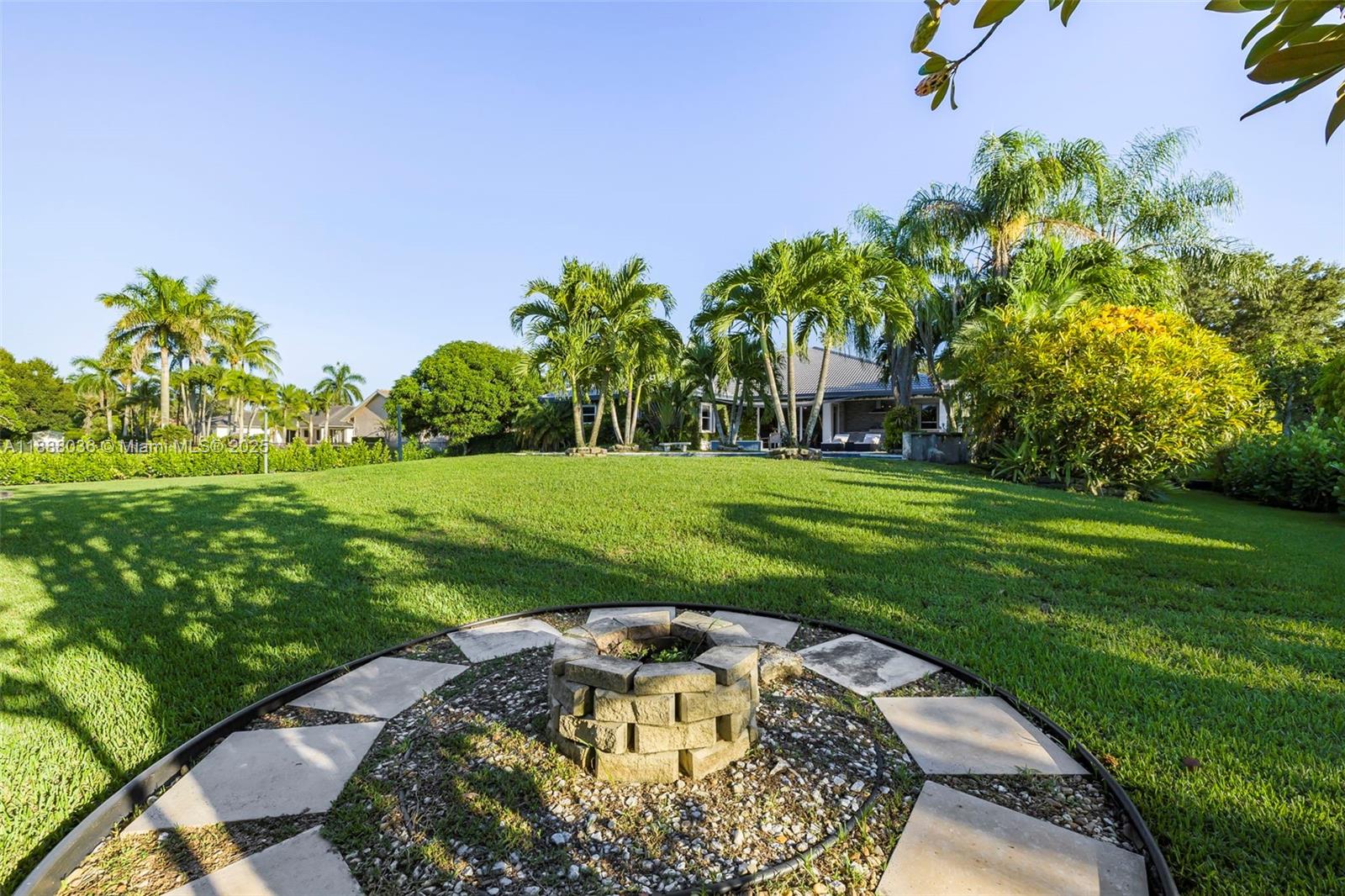 12555 Southwest 34th Place Davie, FL 33330 - Photo 36 of 73 a swimming pool with outdoor seating and garden