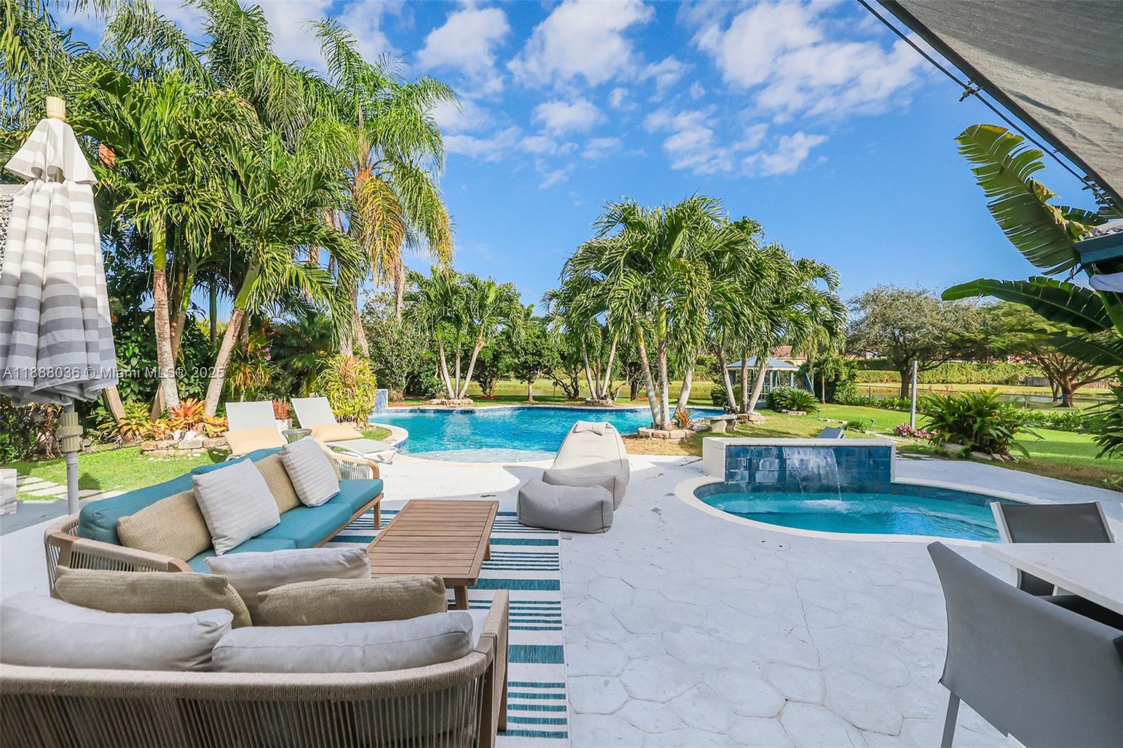 12555 Southwest 34th Place Davie, FL 33330 - Photo 41 of 73 a view of patio with couches and a fire pit