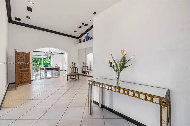 a bed room with a bed and a potted plant