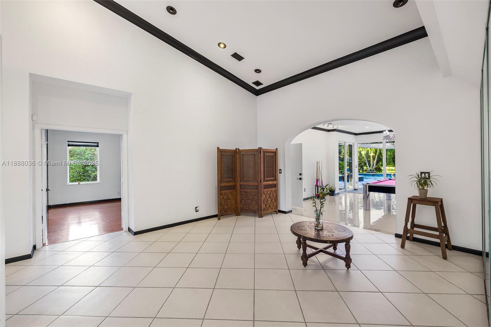 12555 Southwest 34th Place Davie, FL 33330 - Photo 47 of 73 a living room with furniture and a table