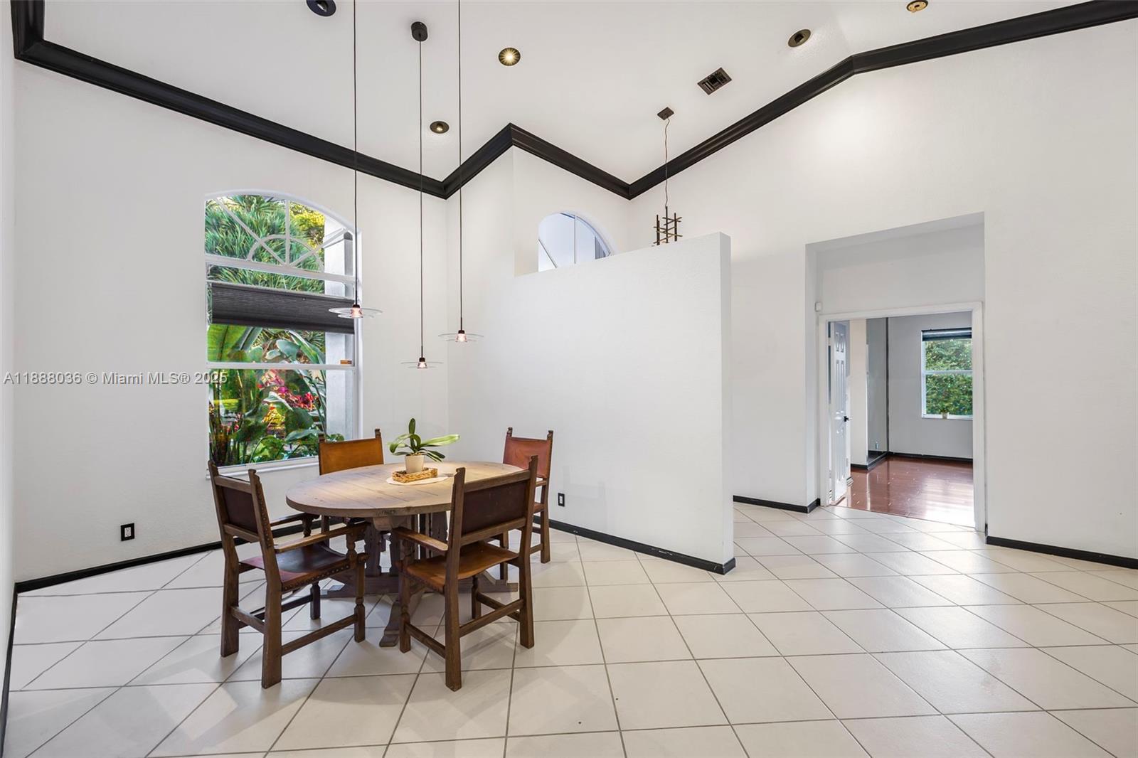 12555 Southwest 34th Place Davie, FL 33330 - Photo 48 of 73 a view of a dining room with furniture window and wooden floor