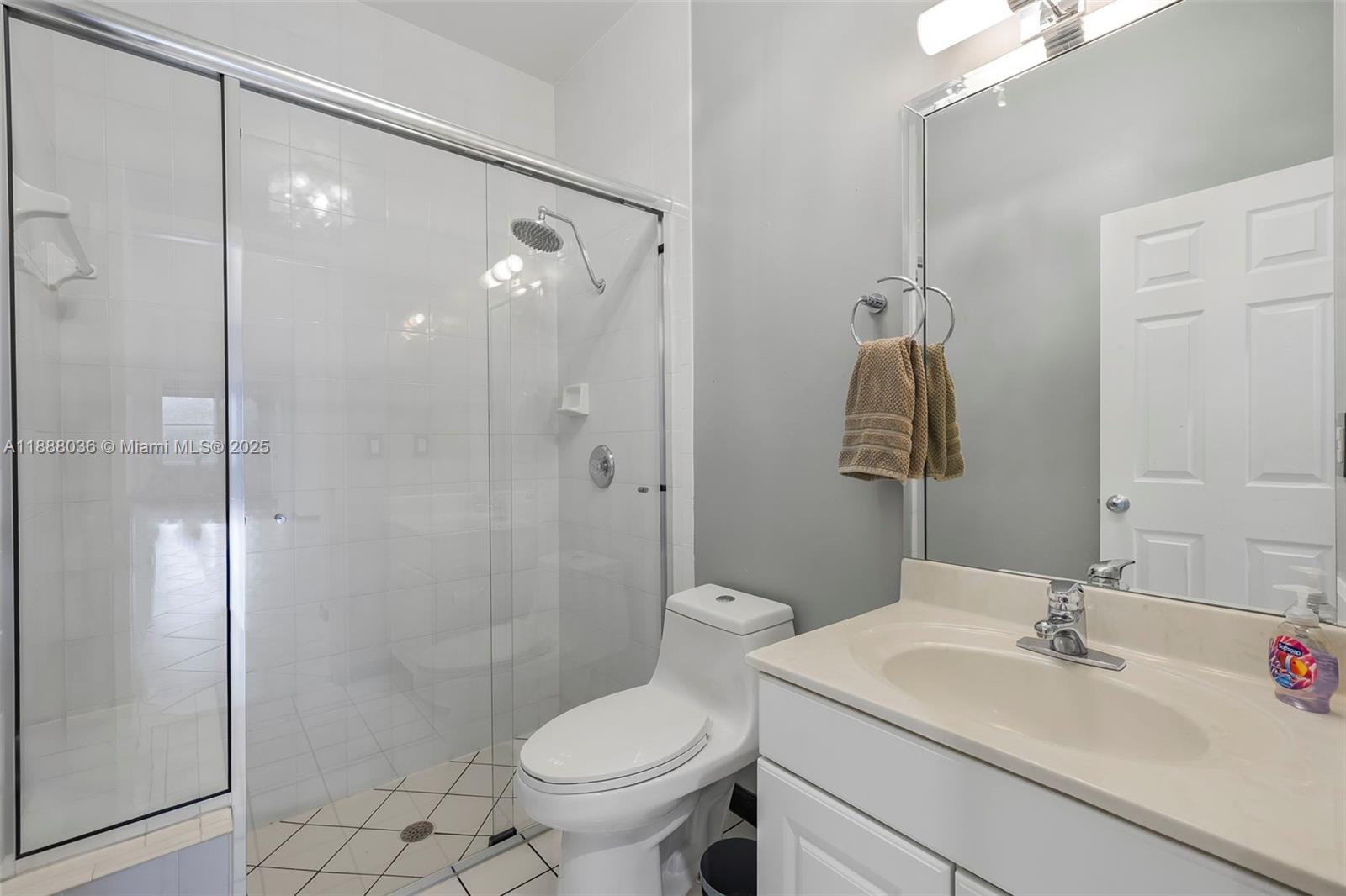 12555 Southwest 34th Place Davie, FL 33330 - Photo 49 of 73 a bathroom with a sink toilet and shower