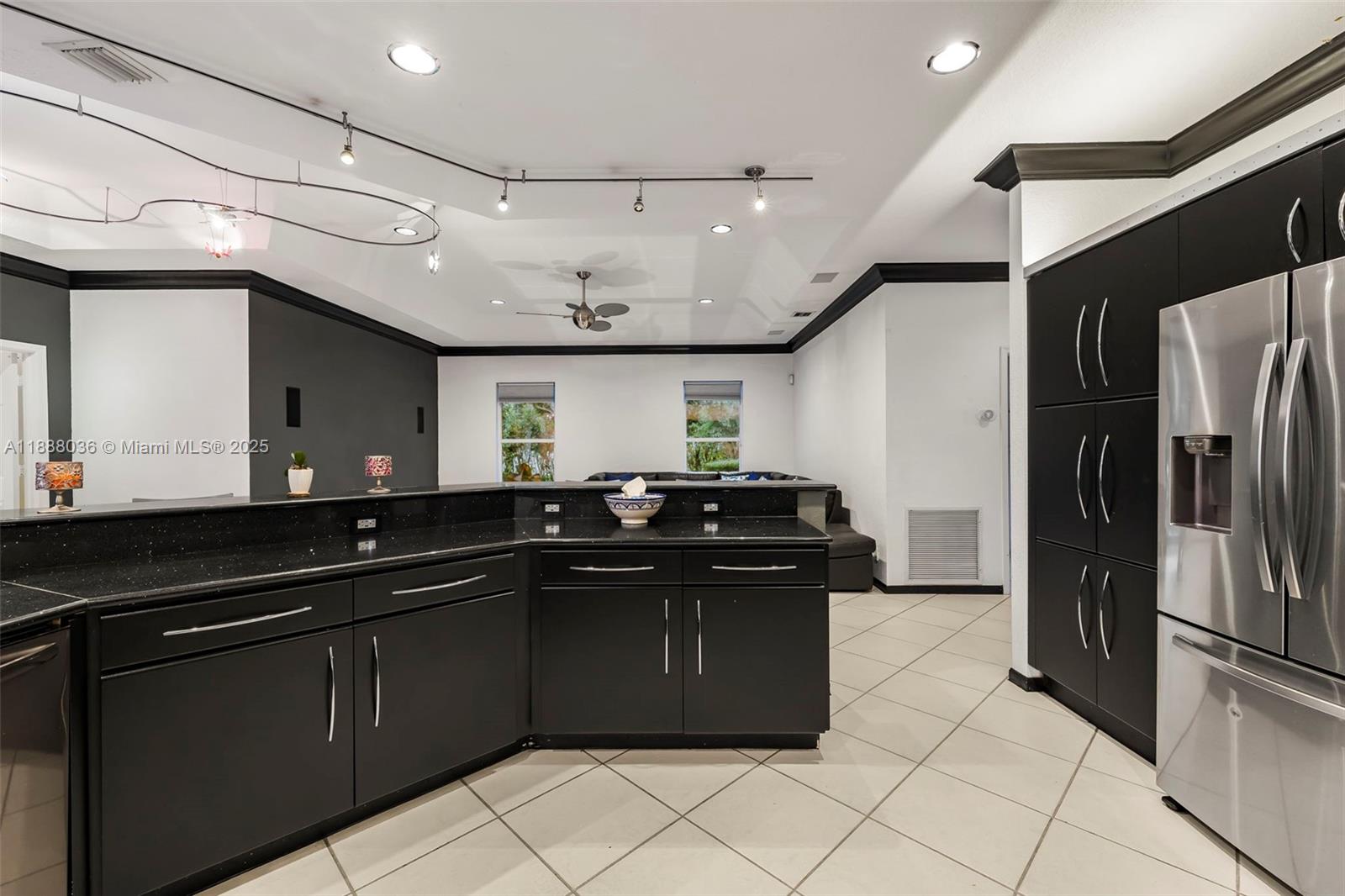 12555 Southwest 34th Place Davie, FL 33330 - Photo 56 of 73 a kitchen with a sink and stainless steel appliances