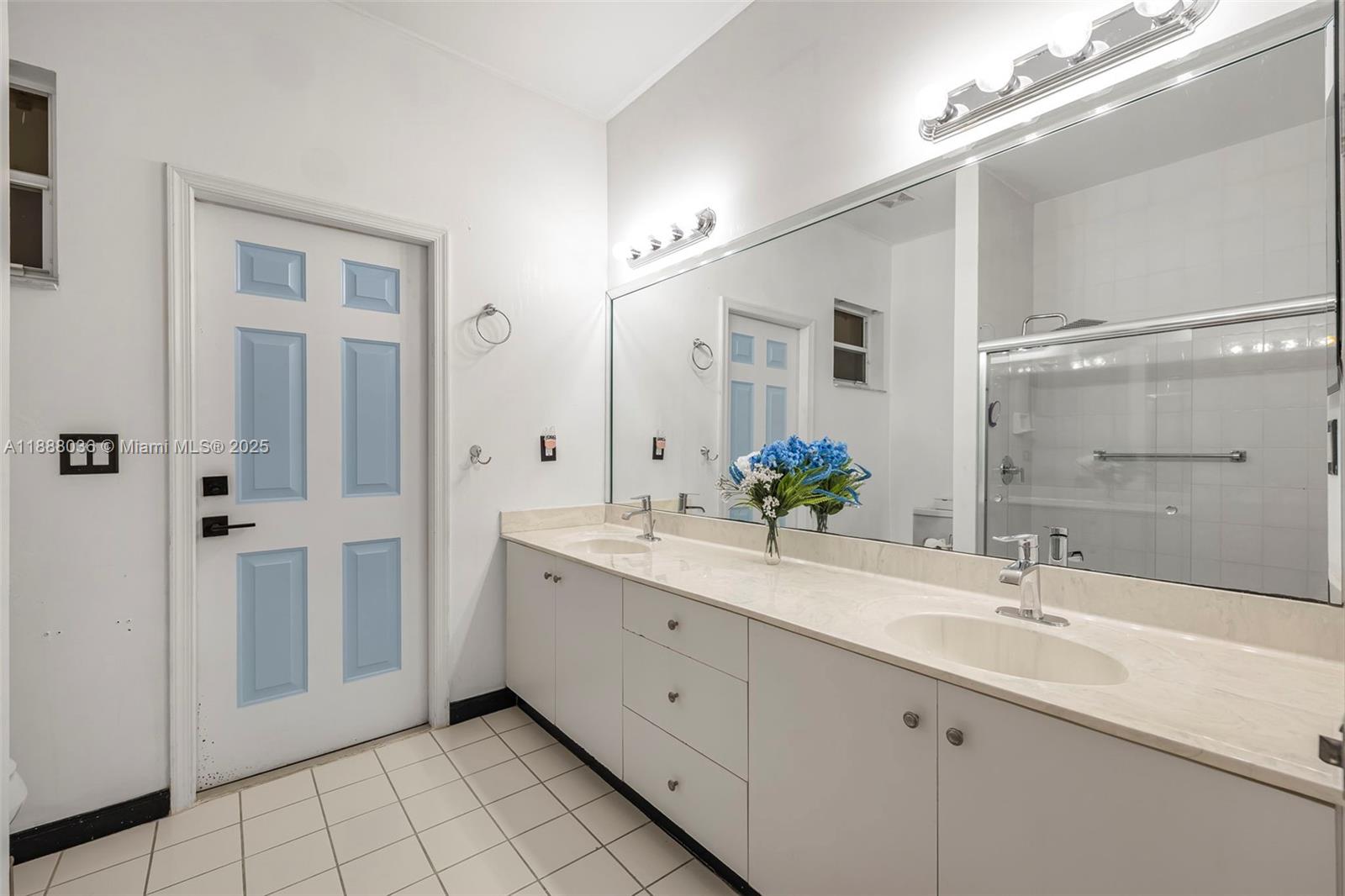 12555 Southwest 34th Place Davie, FL 33330 - Photo 70 of 73 a spacious bathroom with a double vanity sink mirror and