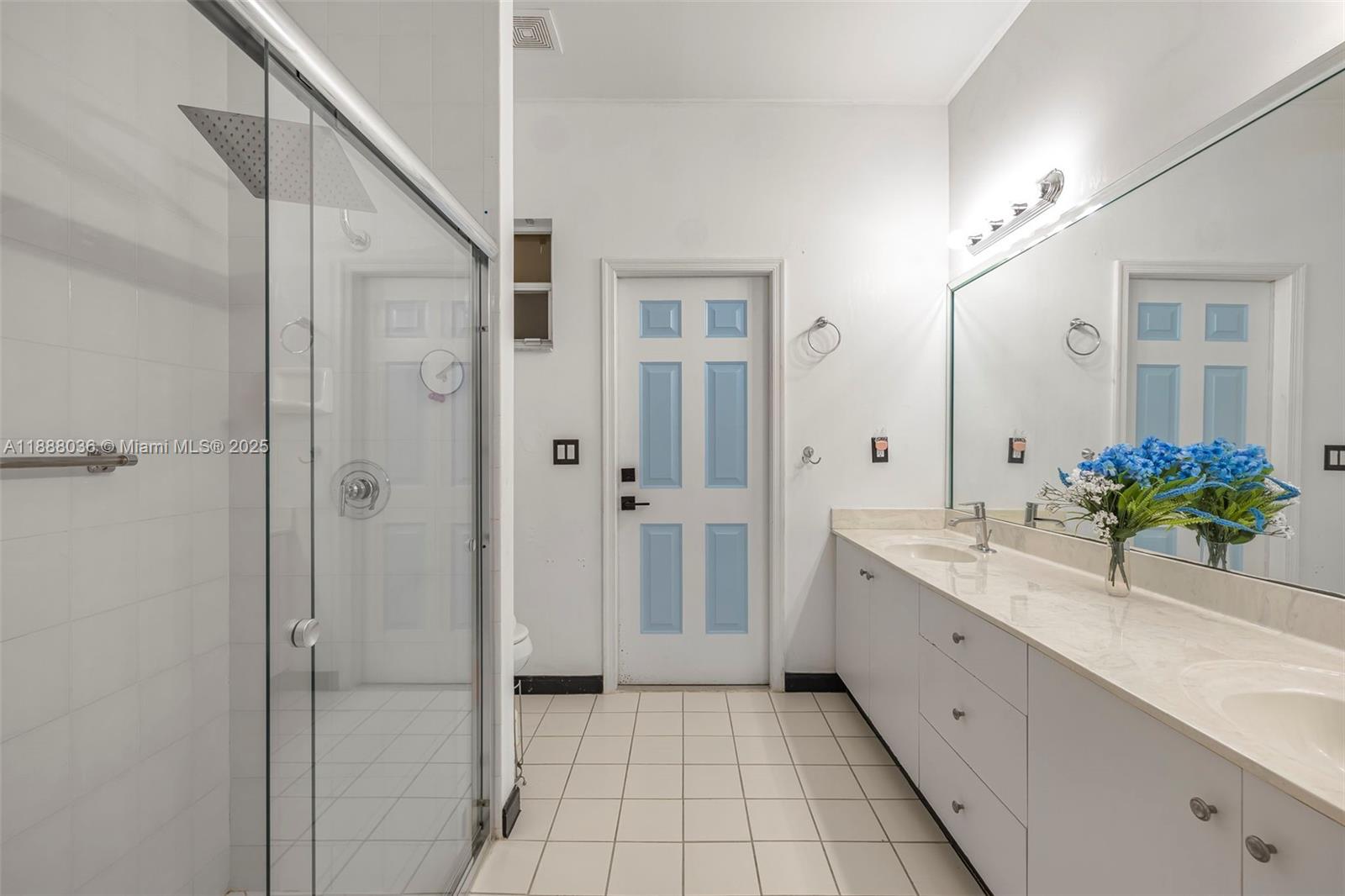 12555 Southwest 34th Place Davie, FL 33330 - Photo 71 of 73 a spacious bathroom with a granite countertop sink a mirror and a bathtub