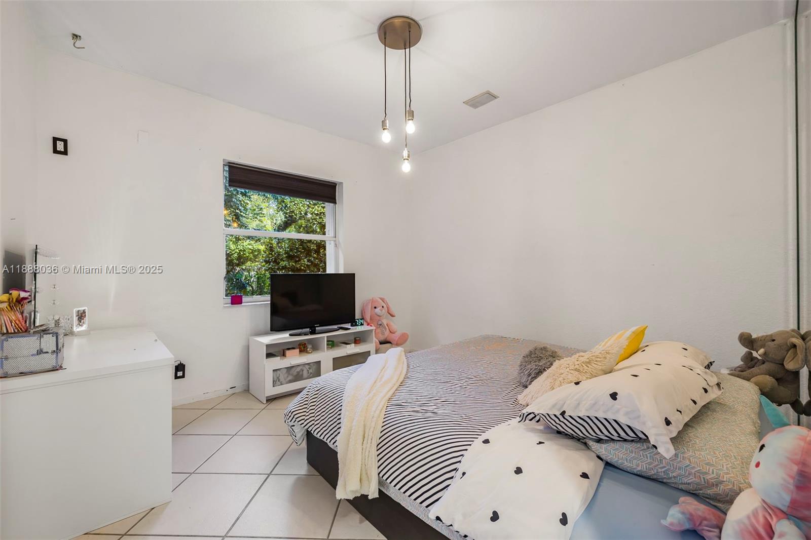 12555 Southwest 34th Place Davie, FL 33330 - Photo 73 of 73 a bedroom with a bed furniture and a flat screen tv