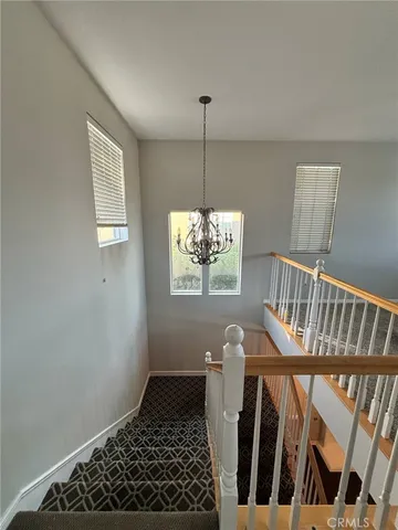 a view of a livingroom with furniture and a window