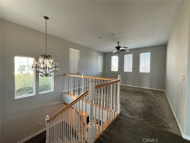 a kitchen with wooden floors and appliances