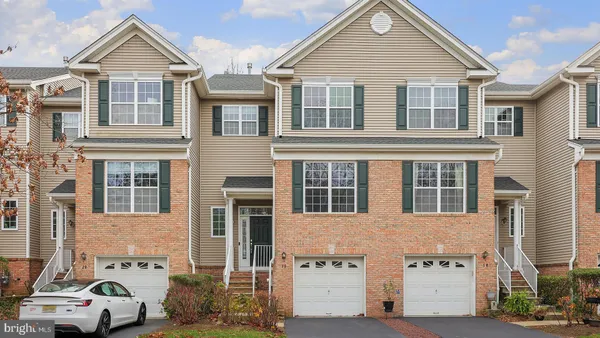 a view of a white building among the street