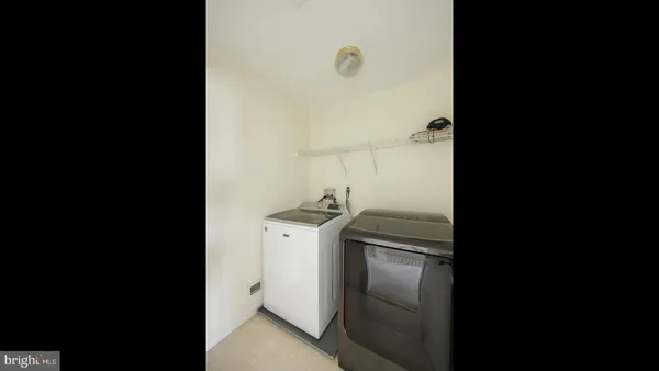 a kitchen with a refrigerator and cabinets