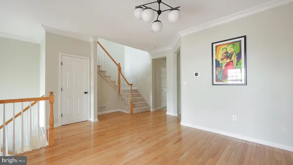 a view of an entryway with wooden floor