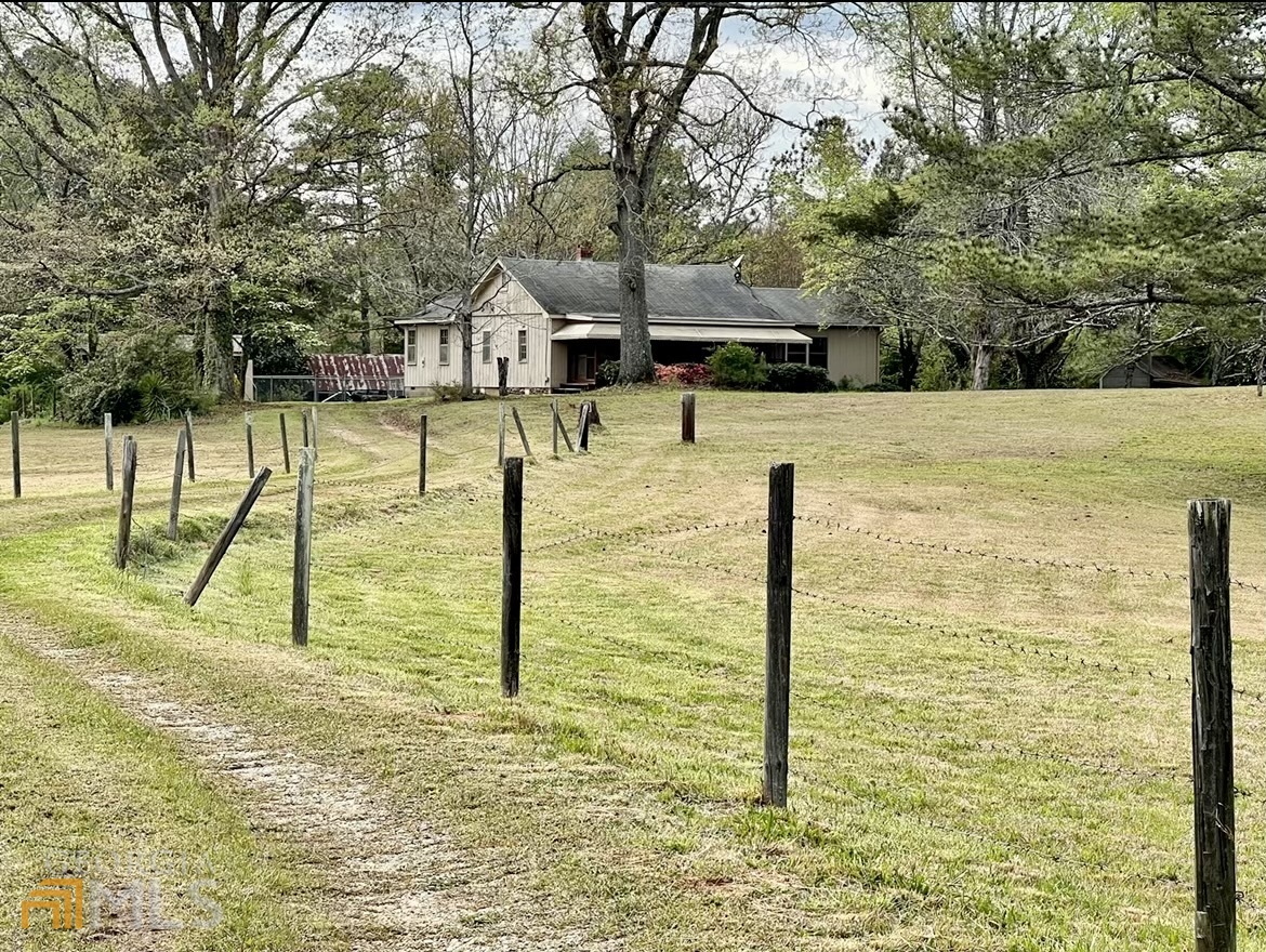 504 Malier Road Hampton, GA 30228 - Photo 1 of 1 a view of a swimming pool with a house