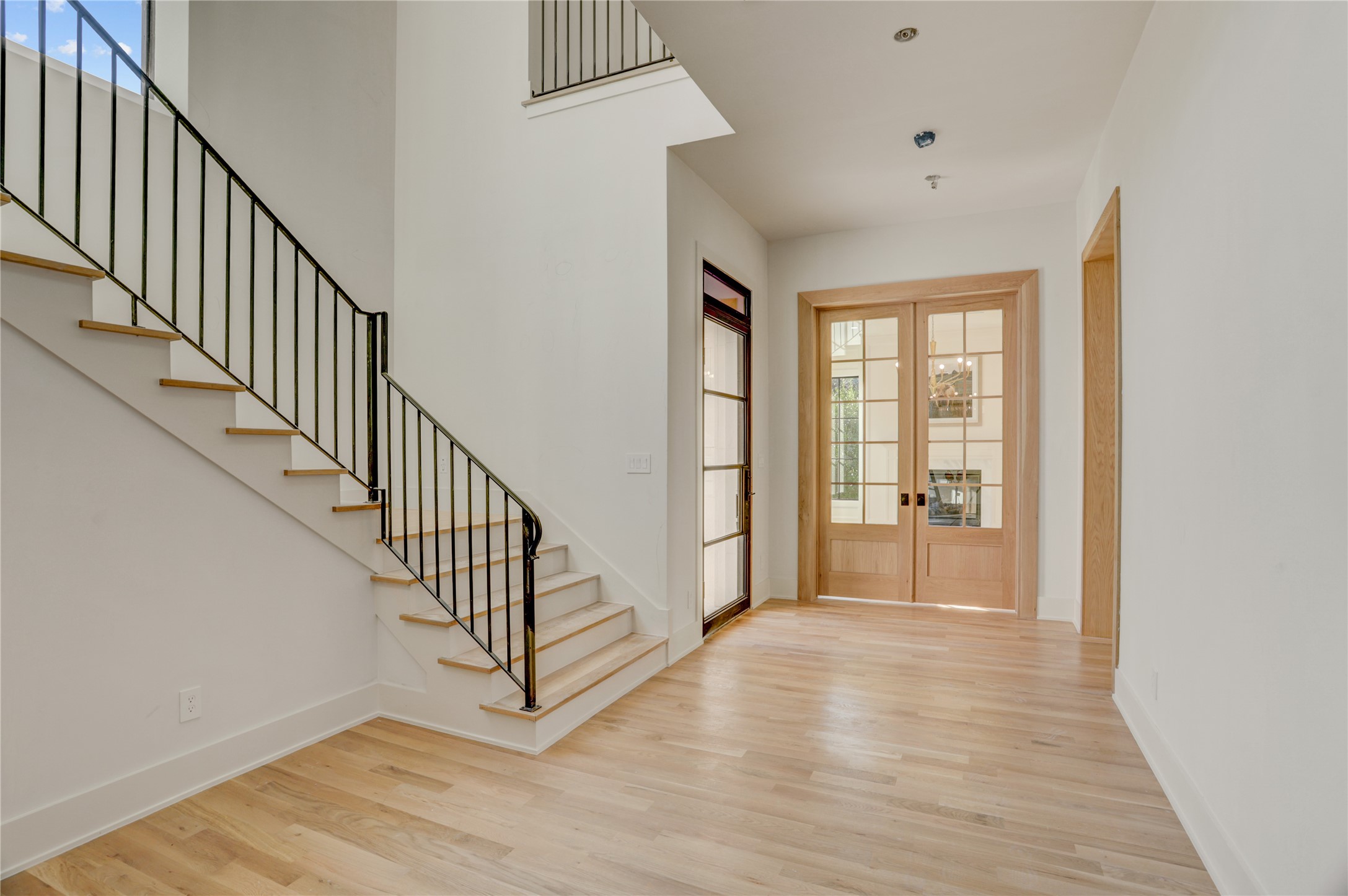 2250 Sunset Boulevard Houston, TX 77005 - Photo 2 of 40 The front entry has a beautifully constructed wrought iron staircase with a handsome study to your left and formal dining with wine-room to your right.