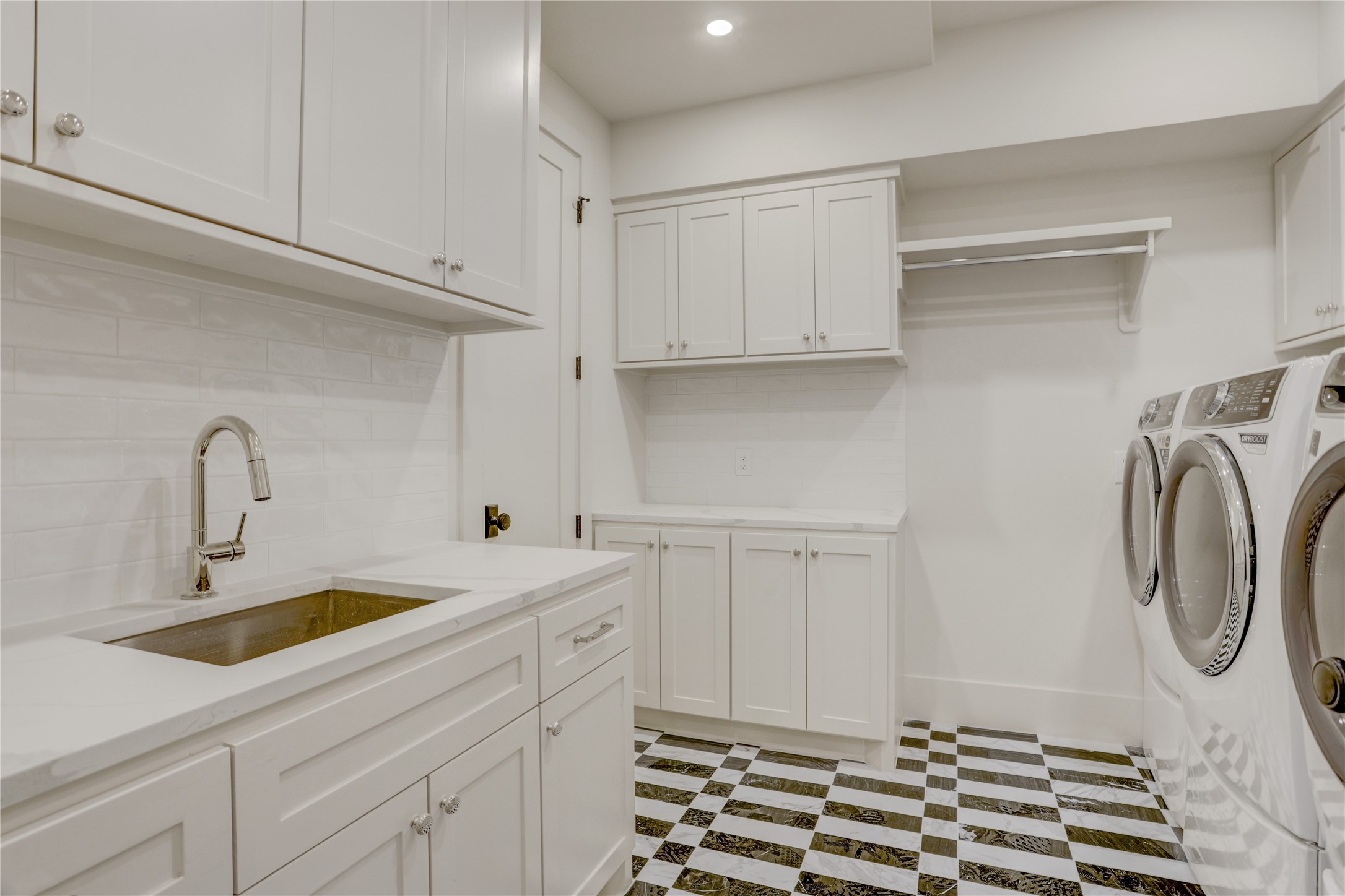 2250 Sunset Boulevard Houston, TX 77005 - Photo 28 of 40 Utility room has a separate broom closet and has double full size washers/double dryers.