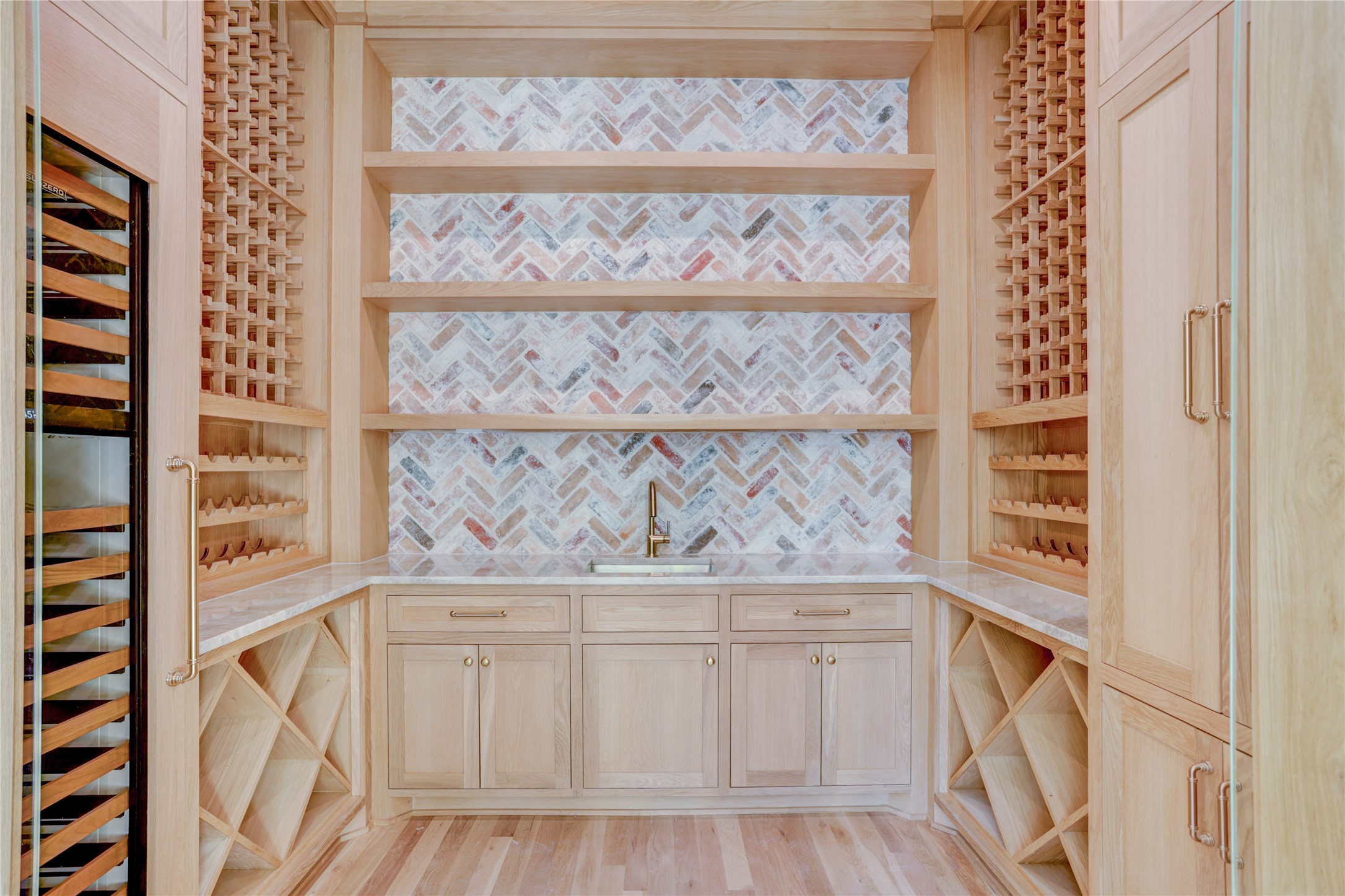 2250 Sunset Boulevard Houston, TX 77005 - Photo 5 of 40 The 1,500 bottle wine room has amazing storage for your collection with wet bar for mixing cocktails and a wine refrigerator for white/rose bottles as well.