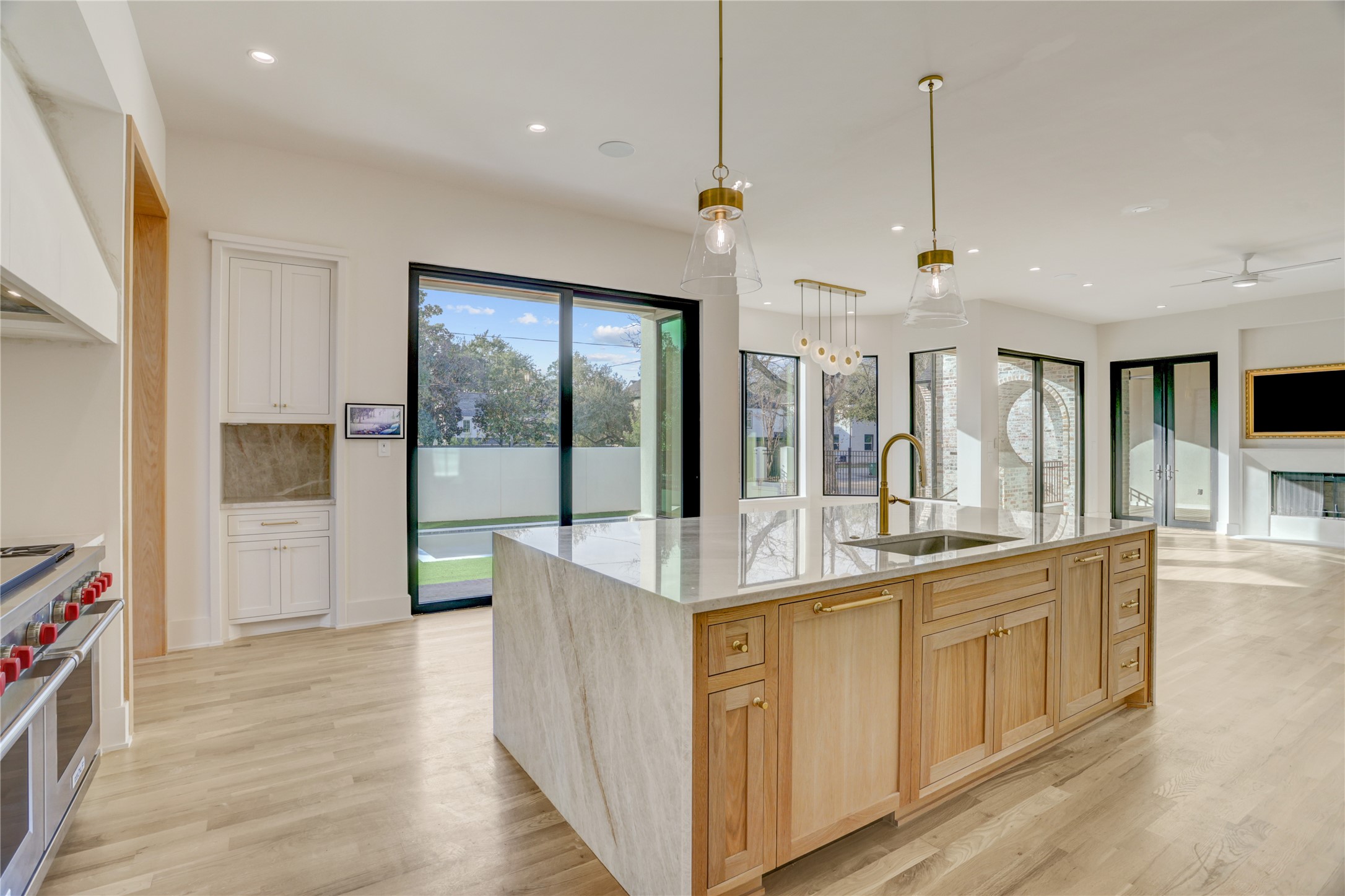 2250 Sunset Boulevard Houston, TX 77005 - Photo 7 of 40 Ina Garten or Bobby Flay would be right at home in this kitchen! The white oak expansive island with seating for six offers a place to prep and serve meals to family and friends or large gatherings.