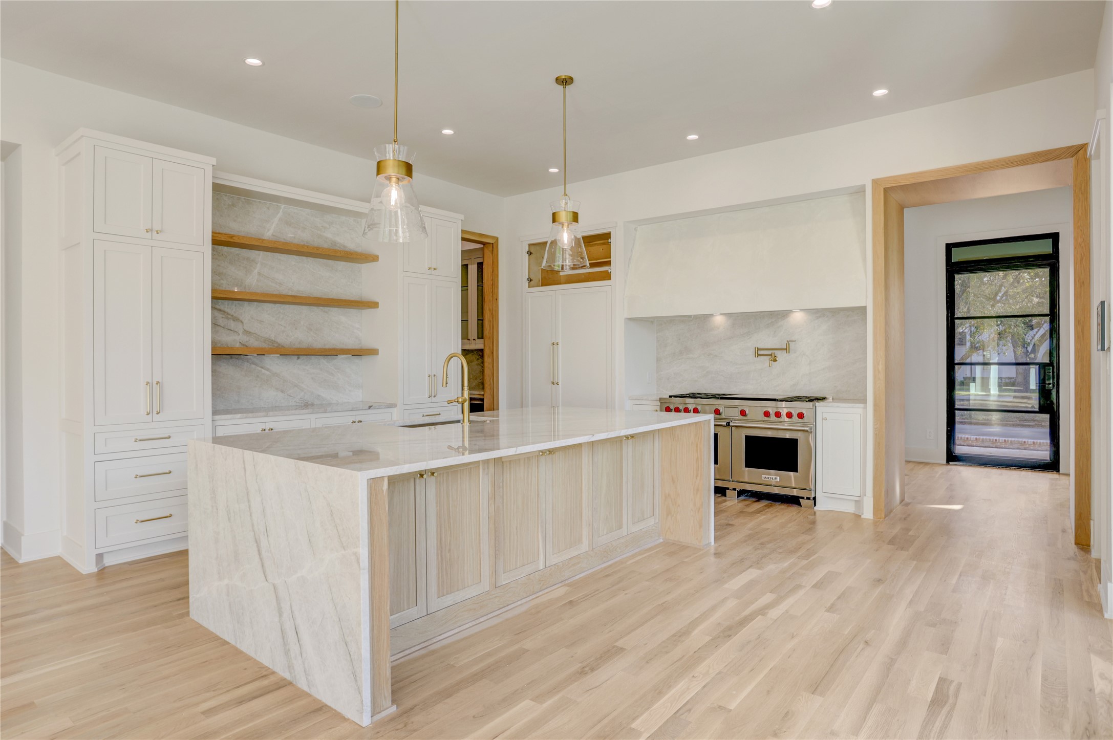 2250 Sunset Boulevard Houston, TX 77005 - Photo 9 of 40 Another view of the kitchen. Exposed shelves to display your dishware with abundant hidden storage for pots, pans, and every cooking utensil imaginable.