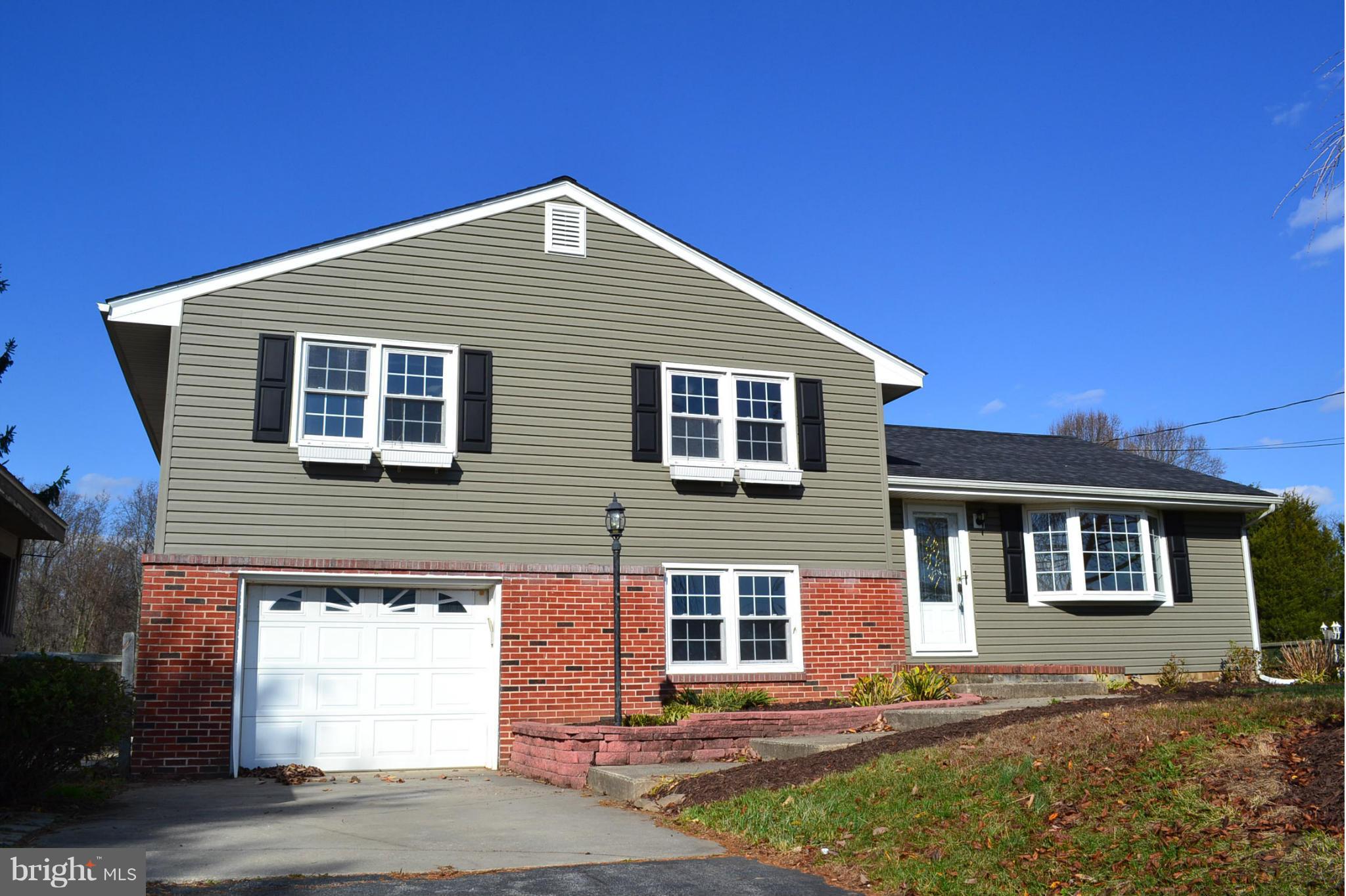 155 Brewster Bridge Road Elkton, MD 21921 - Photo 1 of 30 a front view of a house with a yard