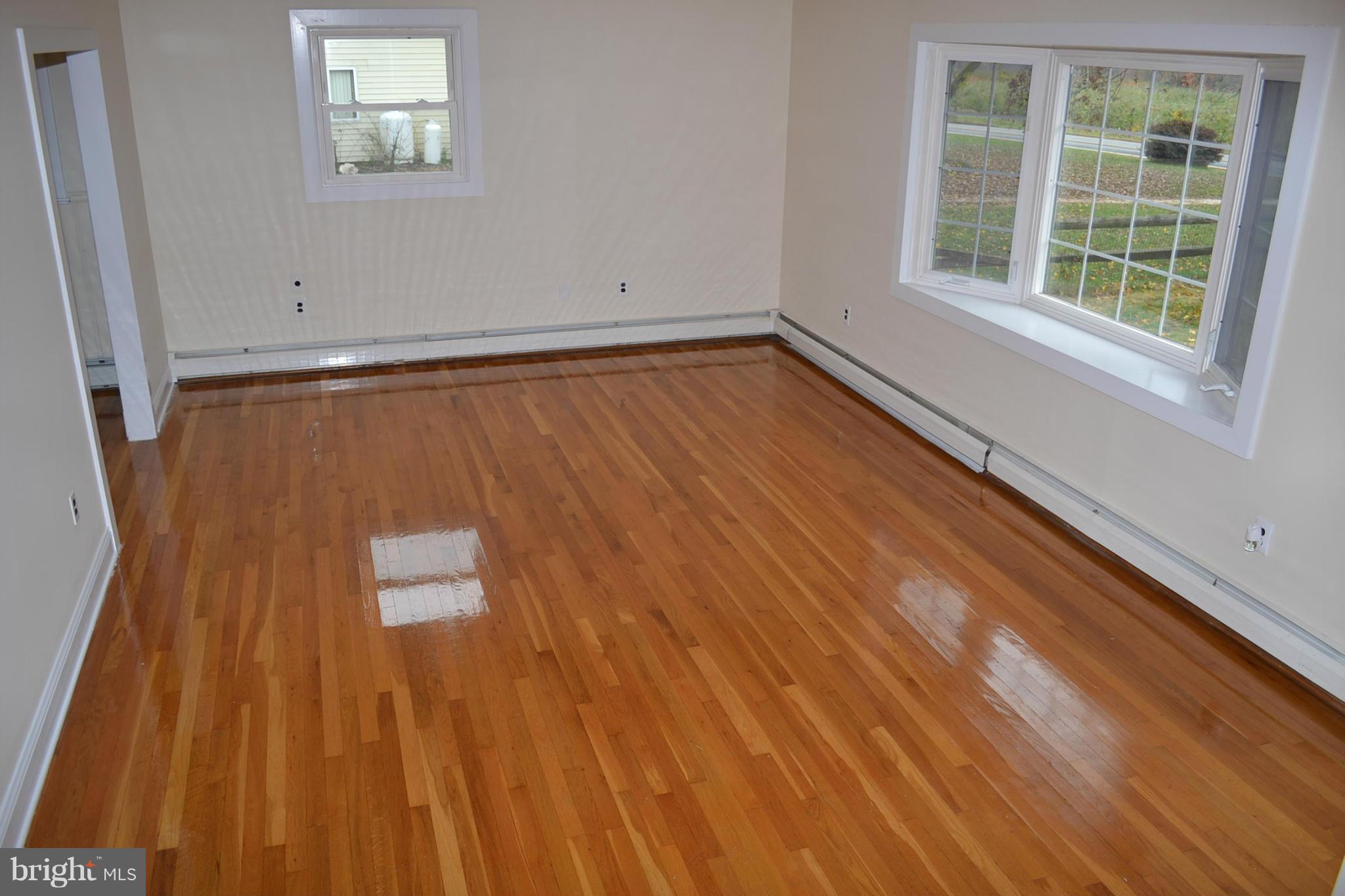 155 Brewster Bridge Road Elkton, MD 21921 - Photo 2 of 30 a view of a room with wooden floor and window