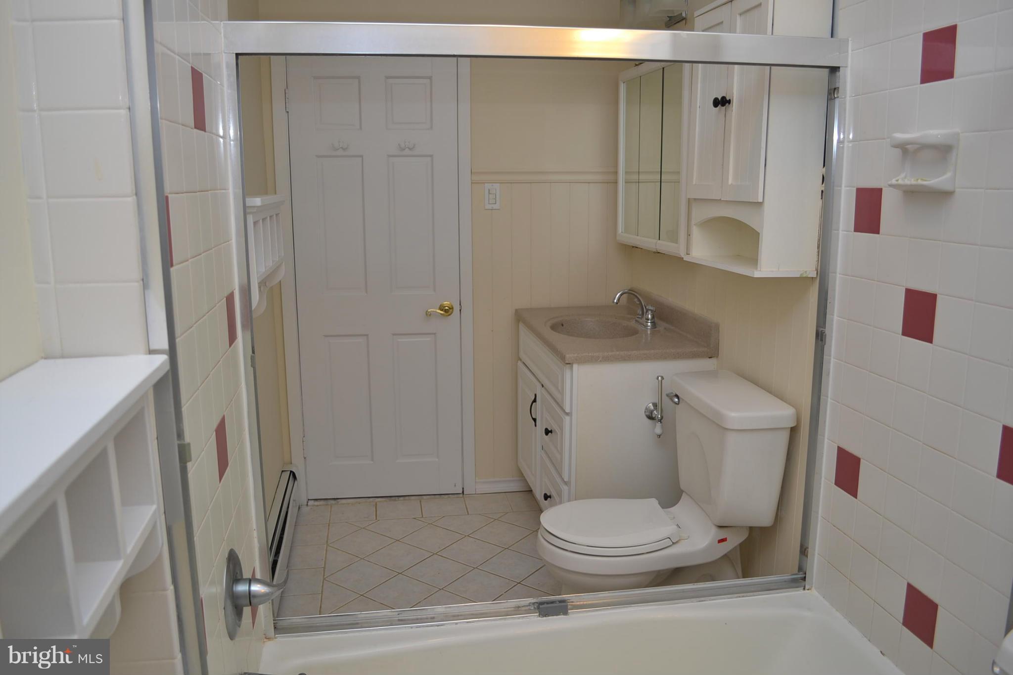 155 Brewster Bridge Road Elkton, MD 21921 - Photo 17 of 30 a white toilet sitting next to a bathroom sink