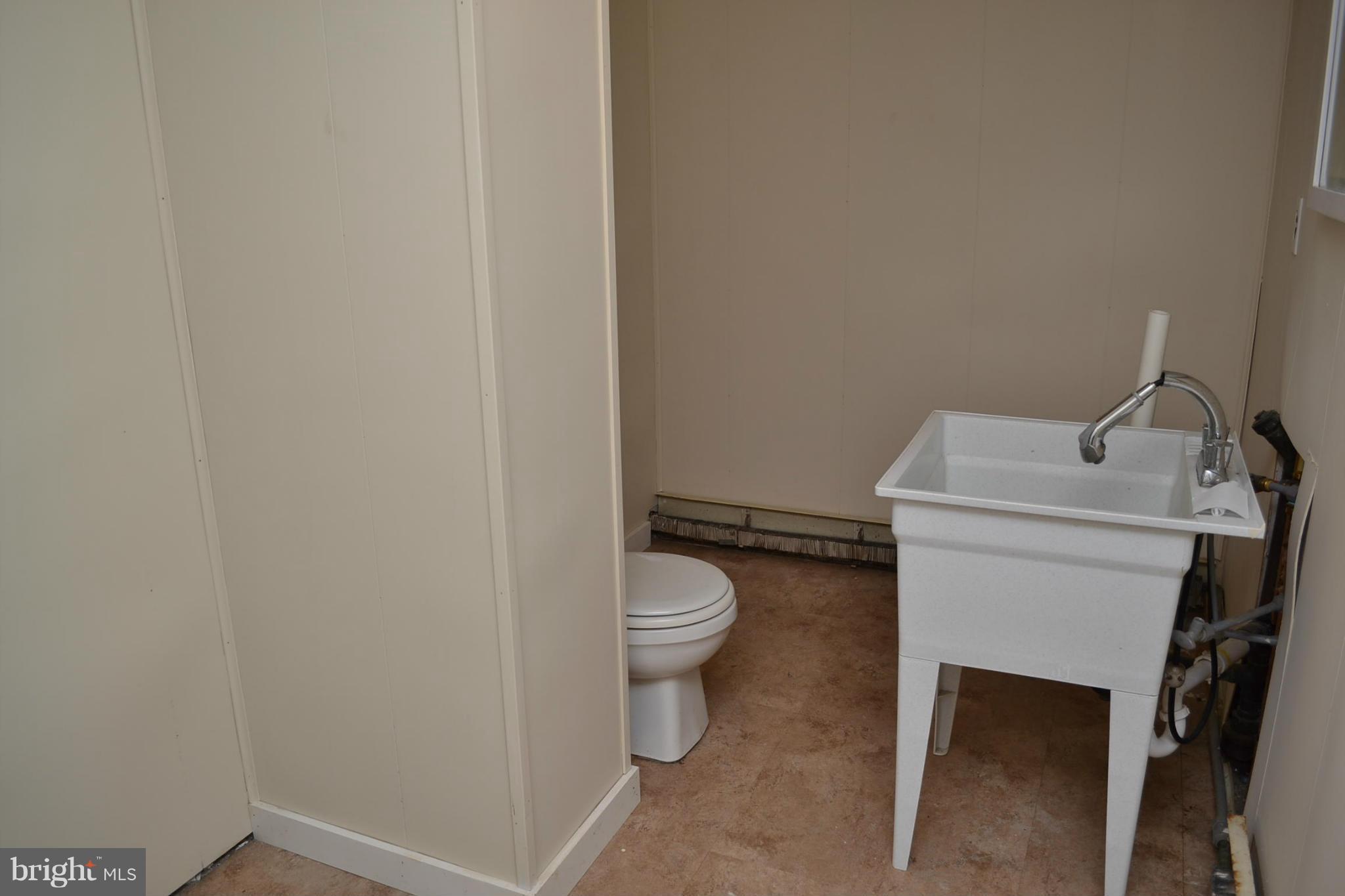 155 Brewster Bridge Road Elkton, MD 21921 - Photo 19 of 30 a bathroom with a toilet and a sink