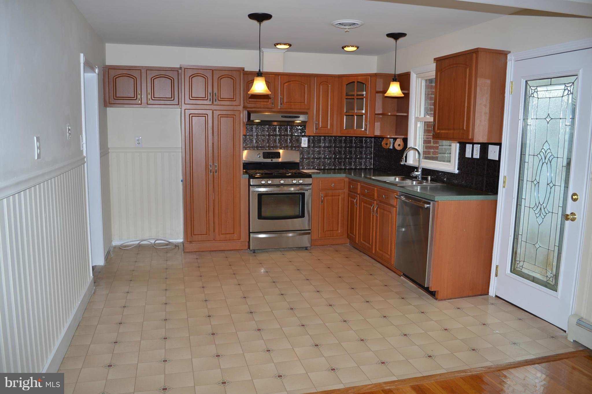 155 Brewster Bridge Road Elkton, MD 21921 - Photo 3 of 30 a kitchen with stainless steel appliances granite countertop a stove a refrigerator and a sink