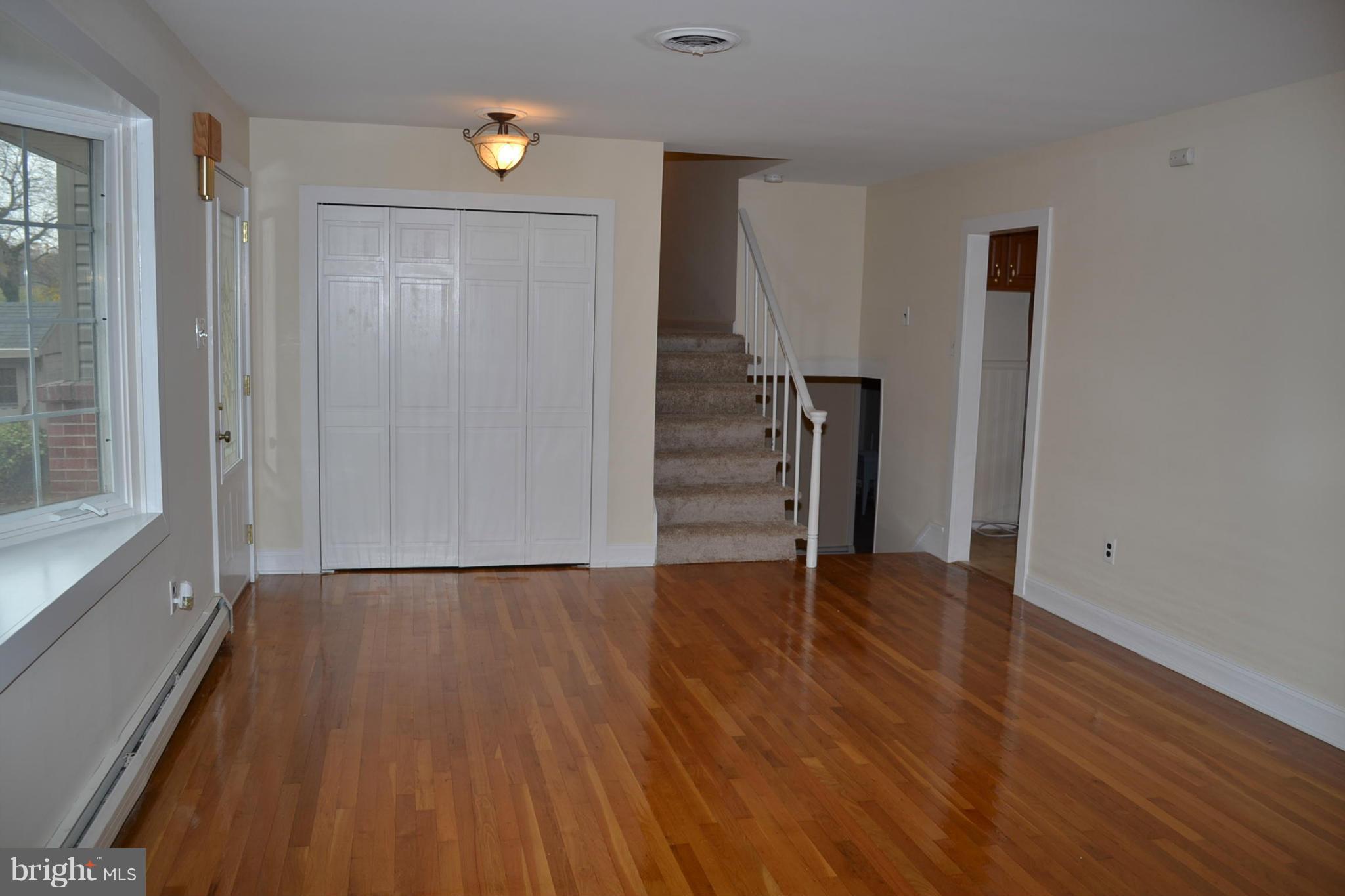 155 Brewster Bridge Road Elkton, MD 21921 - Photo 8 of 30 a view of empty room with wooden floor and window