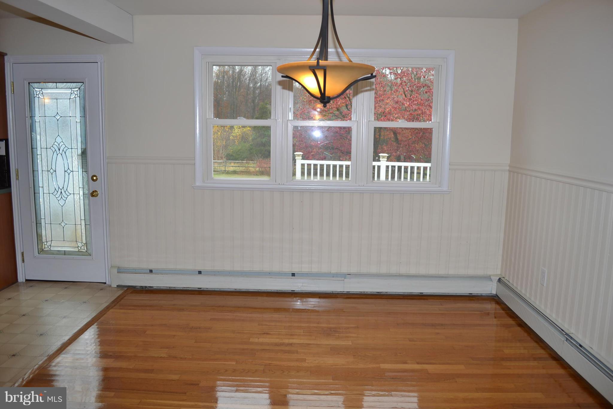 155 Brewster Bridge Road Elkton, MD 21921 - Photo 9 of 30 a view of a room with wooden floor and windows