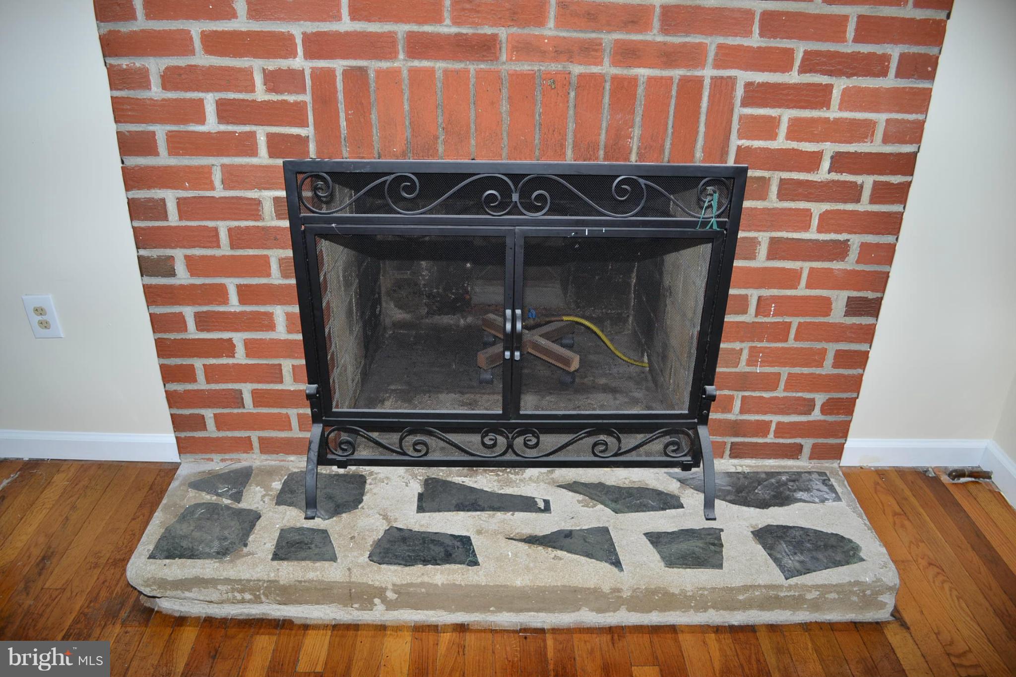 155 Brewster Bridge Road Elkton, MD 21921 - Photo 10 of 30 a view of a fireplace with wooden floor