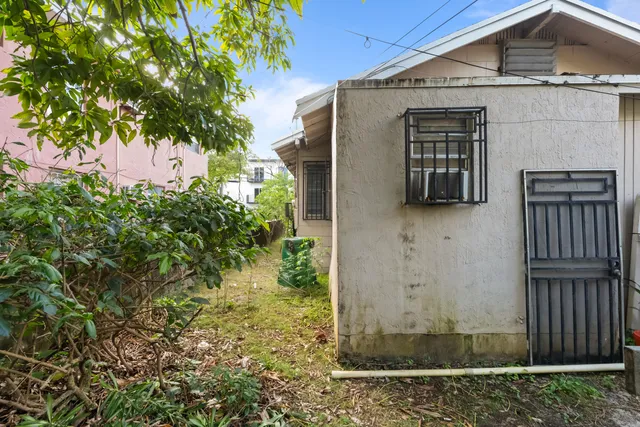 a view of a house with a tree