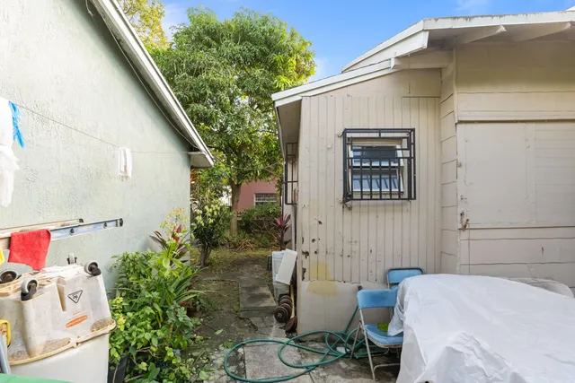 a balcony with table and chairs