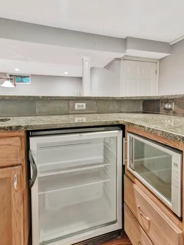 a stove top oven sitting inside of a kitchen