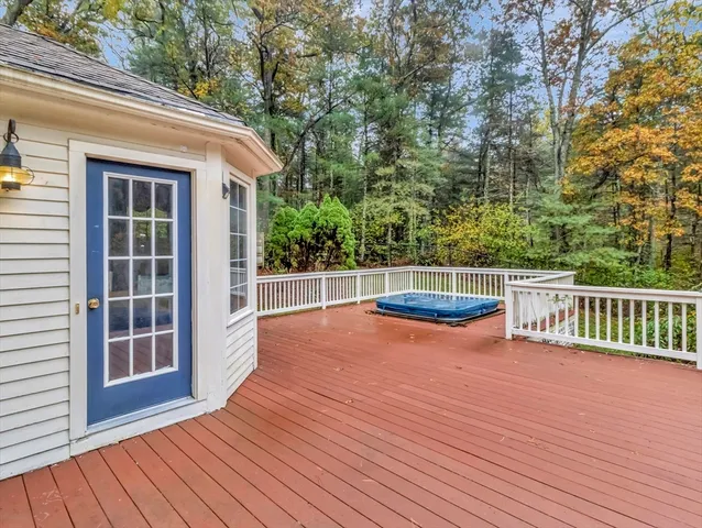 a view of a roof deck with wooden floor and fence