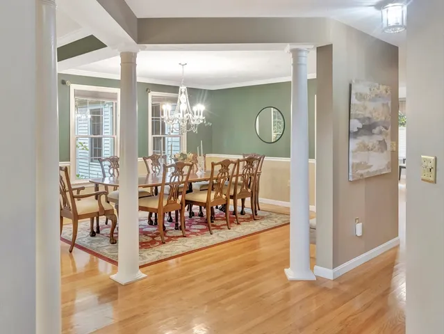 a view of dining room with furniture and wooden floor