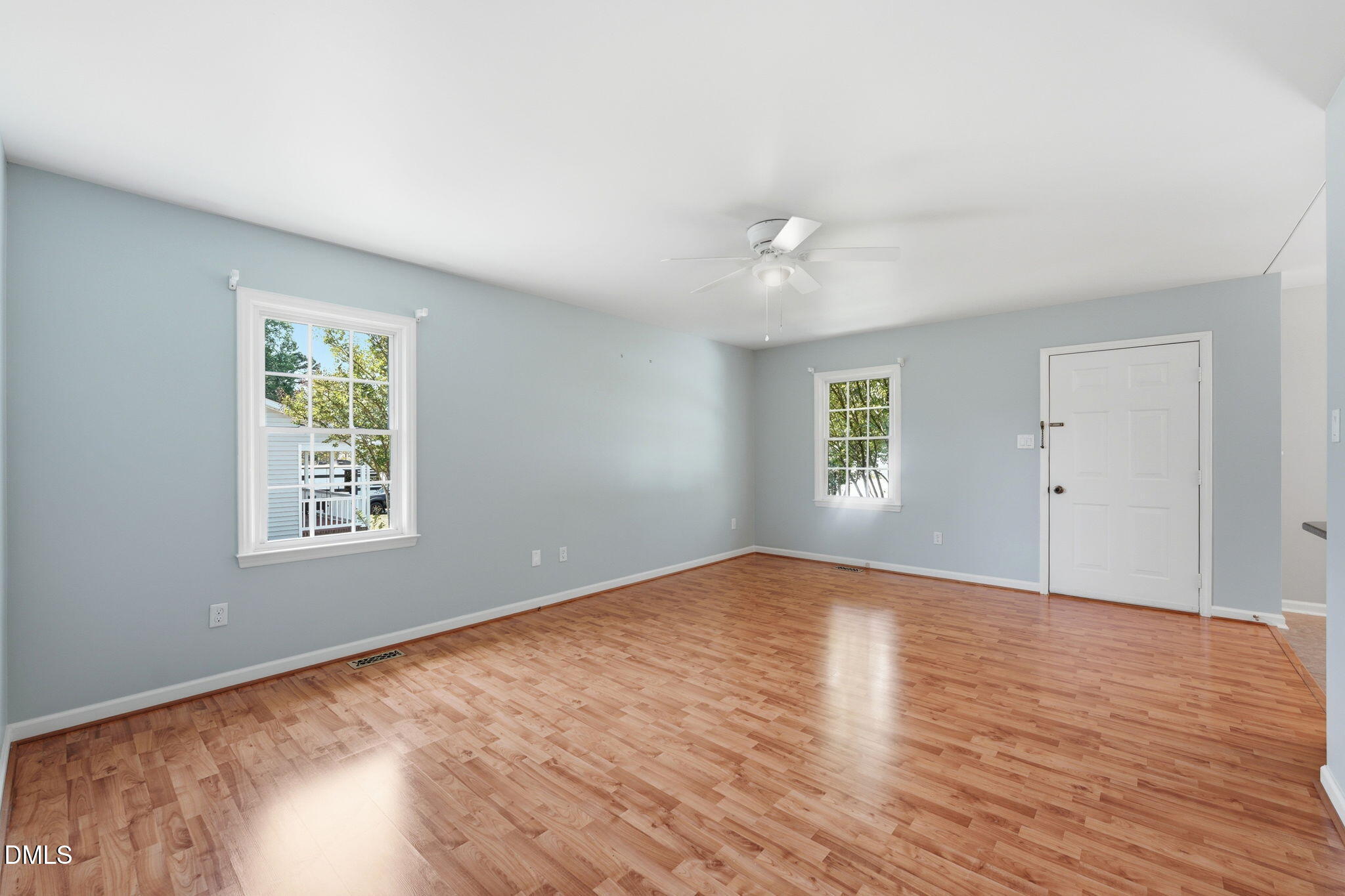 812 East Stagecoach Road Mebane, NC 27302 - Photo 6 of 25 an empty room with wooden floor and windows