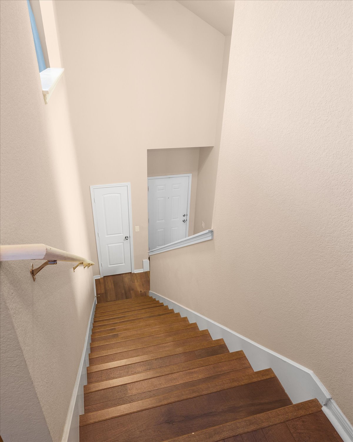 717 Kaluga Trail Leander, TX 78641 - Photo 24 of 40 a view of a room with wooden floor and white walls