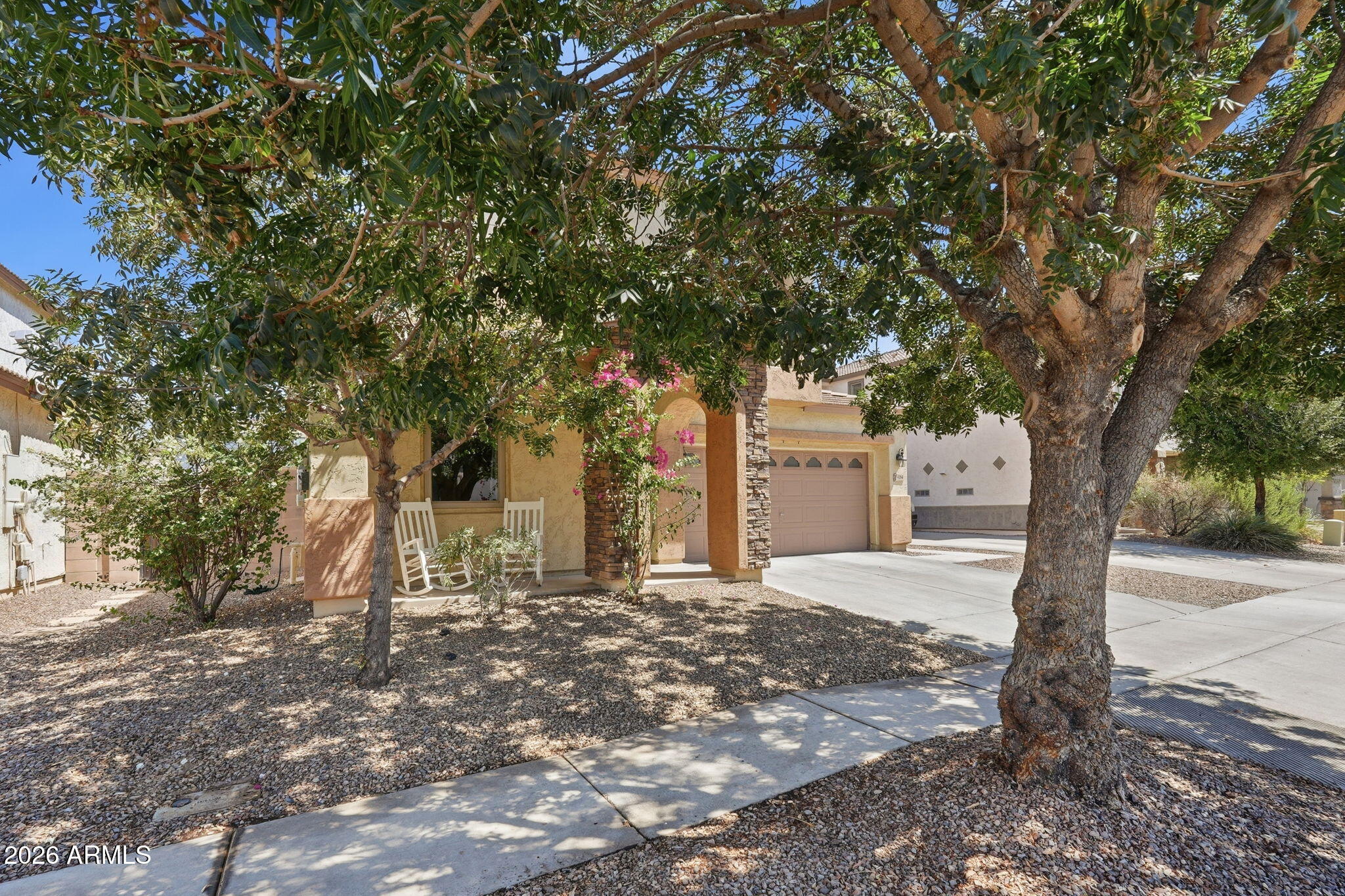 4184 East Trigger Way Gilbert, AZ 85297 - Photo 47 of 51 a large tree in front of a white house