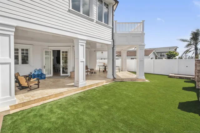 a bathroom with double vanity sink and a mirror