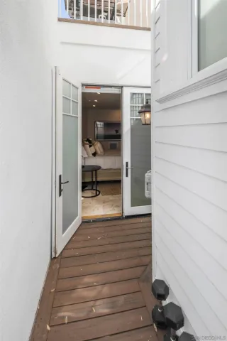 a living room with lots of furniture and a large window