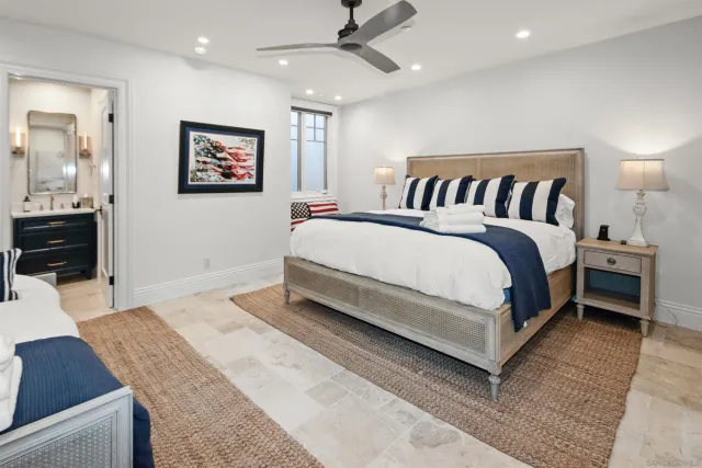 a living room with furniture a rug and a large window