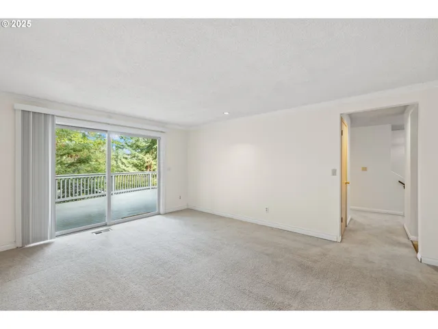a big room with closet and windows
