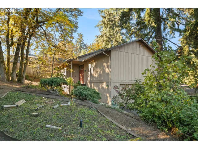 a backyard of a house with lots of green space