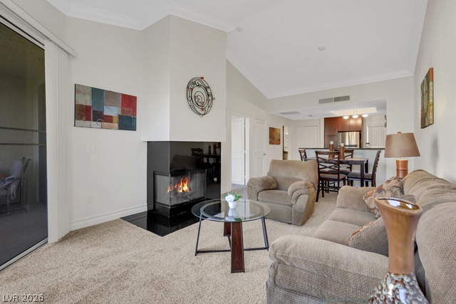 230 East Flamingo Road, Unit 435 Las Vegas, NV 89169 - Photo 15 of 15 A corner fireplace adds warmth to this inviting living space with high ceilings and an open floor plan.