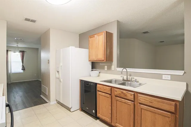 a bathroom with a sink a mirror and a shower