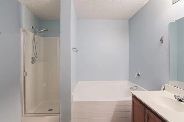a bathroom with a bathtub and a sink