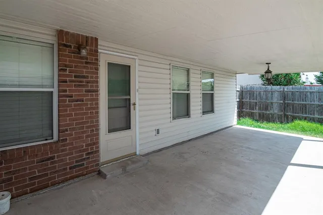 a view of front door and yard