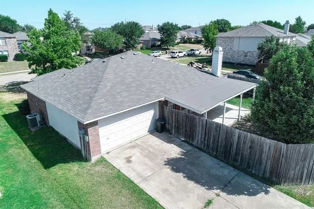 an aerial view of a house having yard